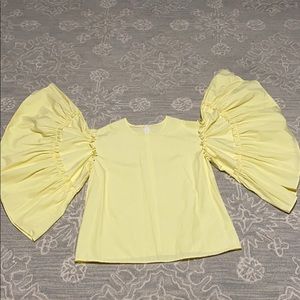 Ruffled yellow blouse
